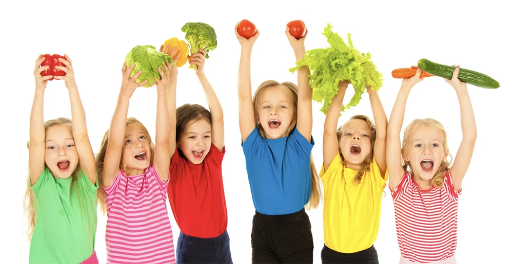 Kids holding fruit and vegetables